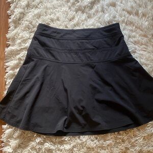 Athleta black skirt with shorts underneath size and back zipper. Size 2